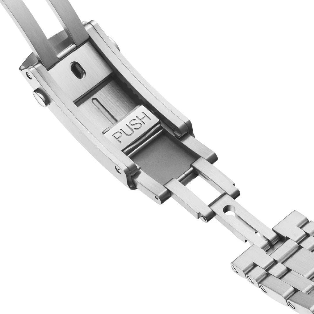Close-up of the OMEGA Seamaster Diver 300M Co-Axial Master Chronometer Chronograph 44mm Watch’s stainless steel clasp, partially open with a "PUSH" button for easy release. Metallic links and the hinge mechanism are clearly visible.