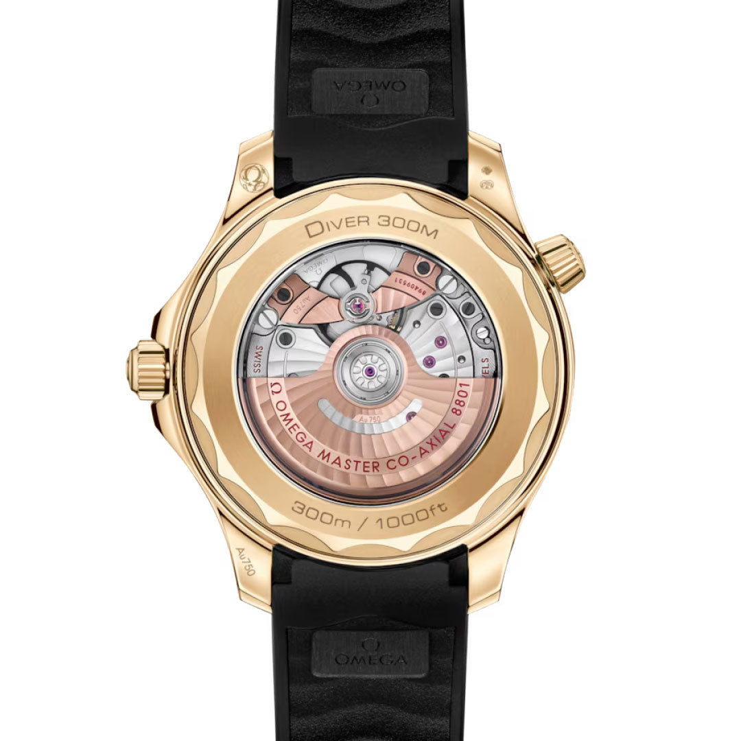 Close-up of the OMEGA Seamaster Diver 300M Co-Axial Master Chronometer 42mm Watch from OMEGA, featuring a transparent case back that reveals the intricate movement and engravings, plus a black strap and elegant 18K Moonshine Gold casing.