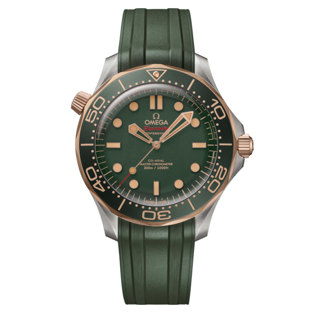 The OMEGA Seamaster Diver 300M Co-Axial Master Chronometer 42mm features a green face with matching rubber strap, gold and silver bezel, bold hour markers, and hands. Its OMEGA Calibre 8806 movement is complemented by various markings and logos on the face and bezel.