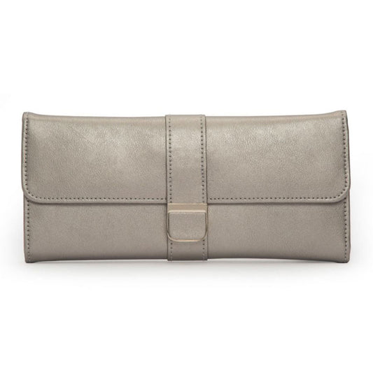 The WOLF 1834 Palermo Jewellery Roll by WOLF is a sophisticated, beige leather accessory designed in a rectangular shape. It includes a front flap that is elegantly secured by a strap with a metal clasp, and features an anti-tarnish lining. With its smooth texture and minimalist design, it's perfect for storing jewelry while traveling.