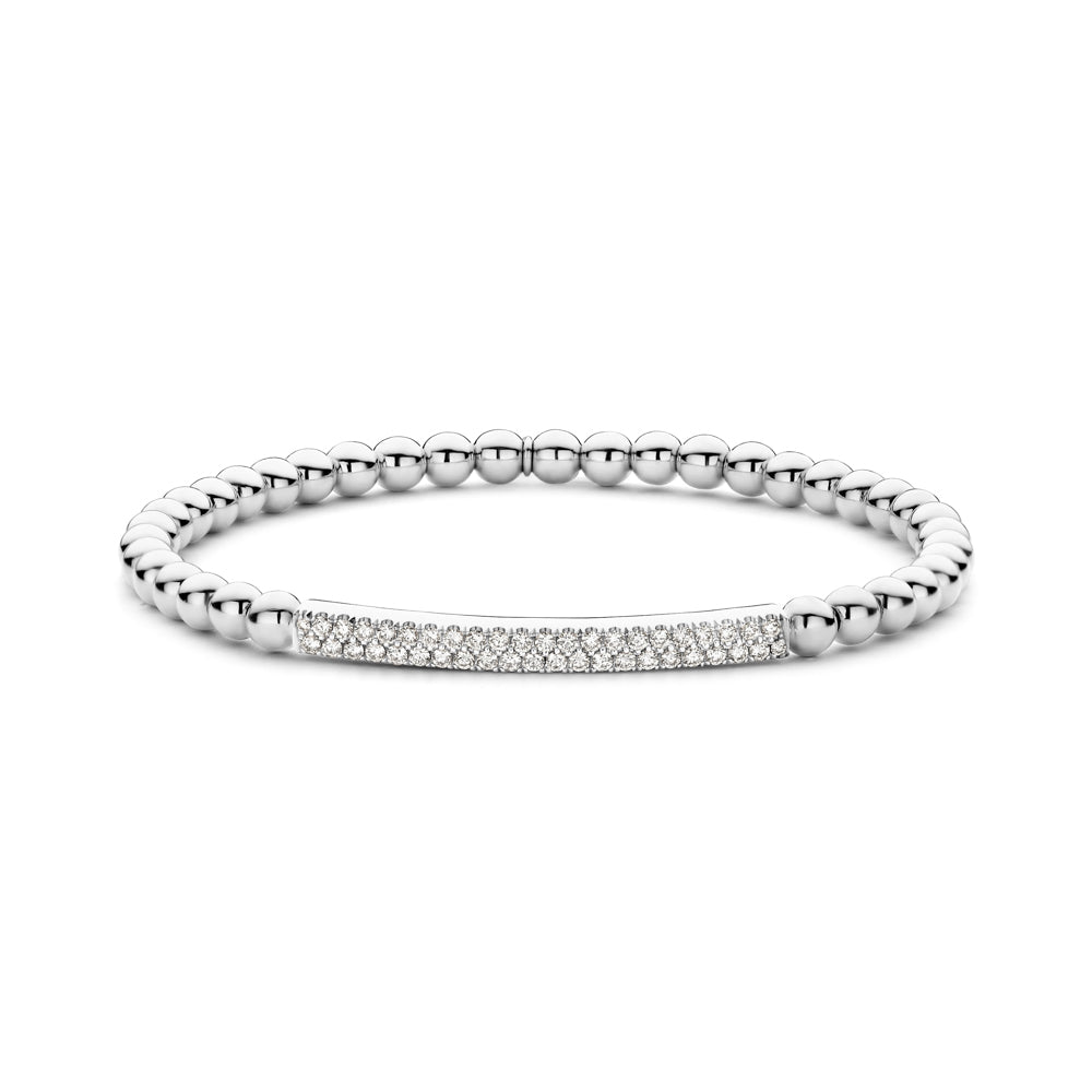 The Hulchi Belluni 18K White Gold Diamond Bracelet features a silver beaded design with a central horizontal bar set with 0.41 CTW round brilliant diamonds, blending simplicity and elegance in a modern style.