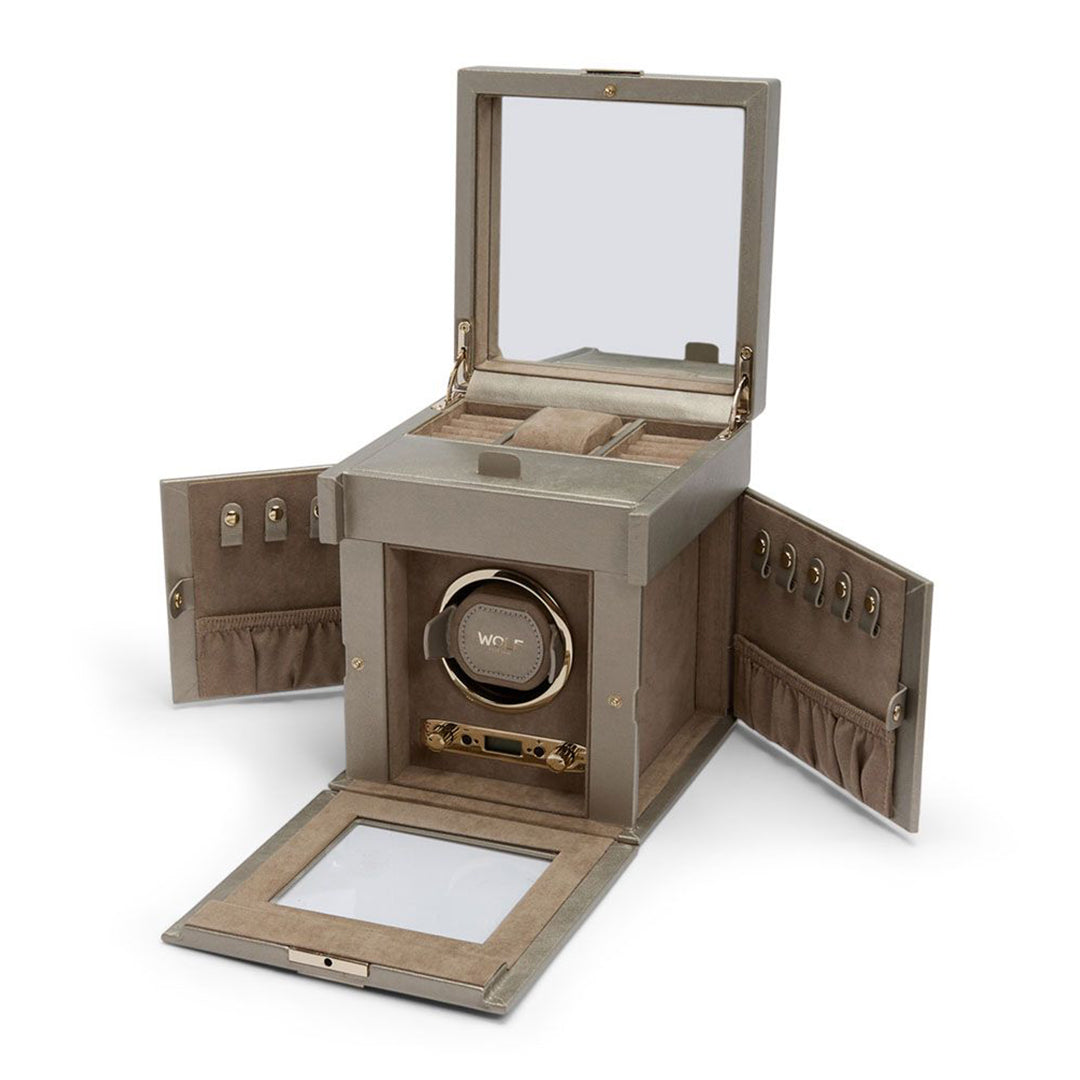 The WOLF 1834 Palermo Single Watch Winder with Jewelry Storage by WOLF features an open-lid design that reveals dedicated compartments for rings and watches, along with a clear section that highlights the rotating watch winder inside. The sides are designed to remain open, offering hooks and pouches for additional storage. Its multiple rotation options enhance its versatility for any collection.