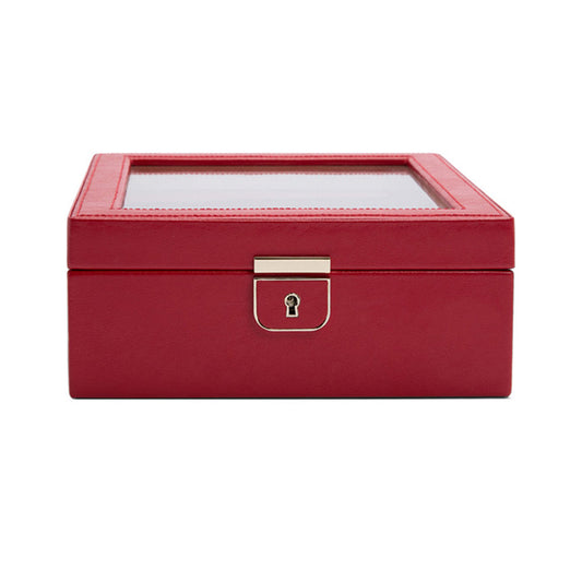 The WOLF 1834 Palermo 6 Piece Watch Box is a closed, red leather jewelry box with a transparent glass lid and enhanced lock and key security. The sleek, rectangular design includes compartments for six watches for added organization.