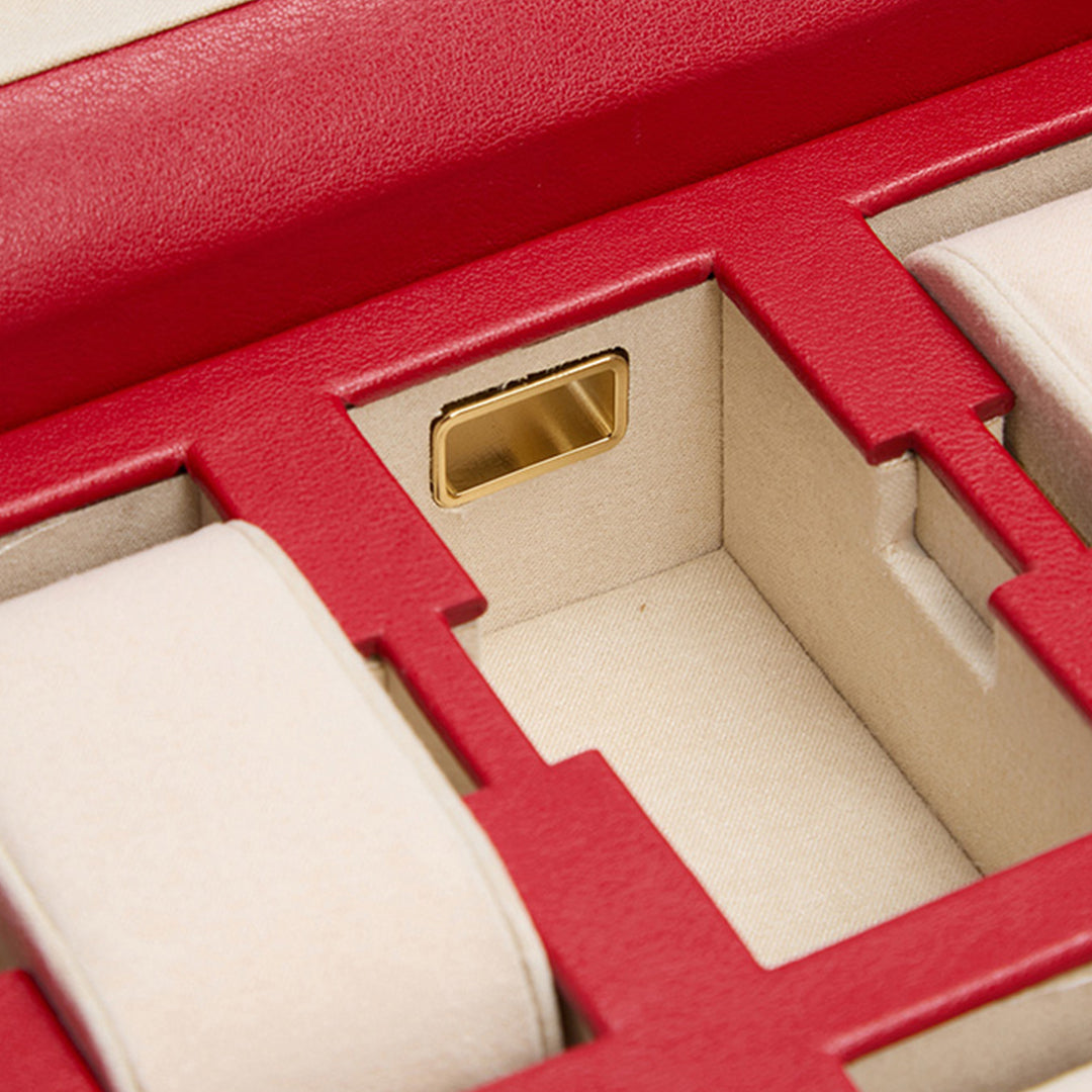 Here's a close-up view of the WOLF 1834 Palermo 6 Piece Watch Box in red and beige, showcasing its cushioned watch compartments perfect for storing your treasured pieces. This elegant watch box features a soft fabric lining with gold-toned accents, offering a luxurious and organized storage solution. Additionally, it includes lock and key security to ensure your valuables are kept safe.