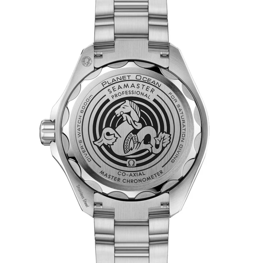 The OMEGA Seamaster Planet Ocean 6000M Ultra Deep Co-Axial Master Chronometer 45.5mm Watch features engraved text and a seahorse graphic on its caseback, framed by a robust metal bracelet.