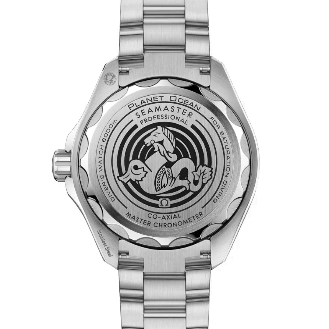 The image features the back of an OMEGA Seamaster Planet Ocean 6000M Ultra Deep Co-Axial Master Chronometer 45.5mm watch in silver. The case showcases detailed engravings, including a seahorse, OMEGA branding, and technical details about its Ultra Deep water resistance and chronometer certification.