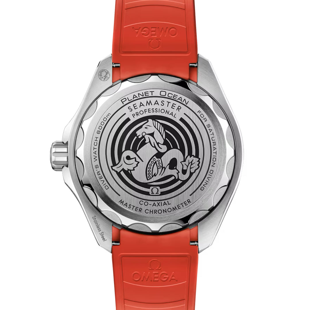 The image displays the back of an OMEGA Seamaster Planet Ocean 6000M Ultra Deep Co-Axial Master Chronometer 45.5mm watch with a red strap in O-MEGASTEEL. The case back includes engravings such as "SEAMASTER," "PROFESSIONAL," and seahorse graphics amidst wave patterns, highlighted by Super-LumiNova.