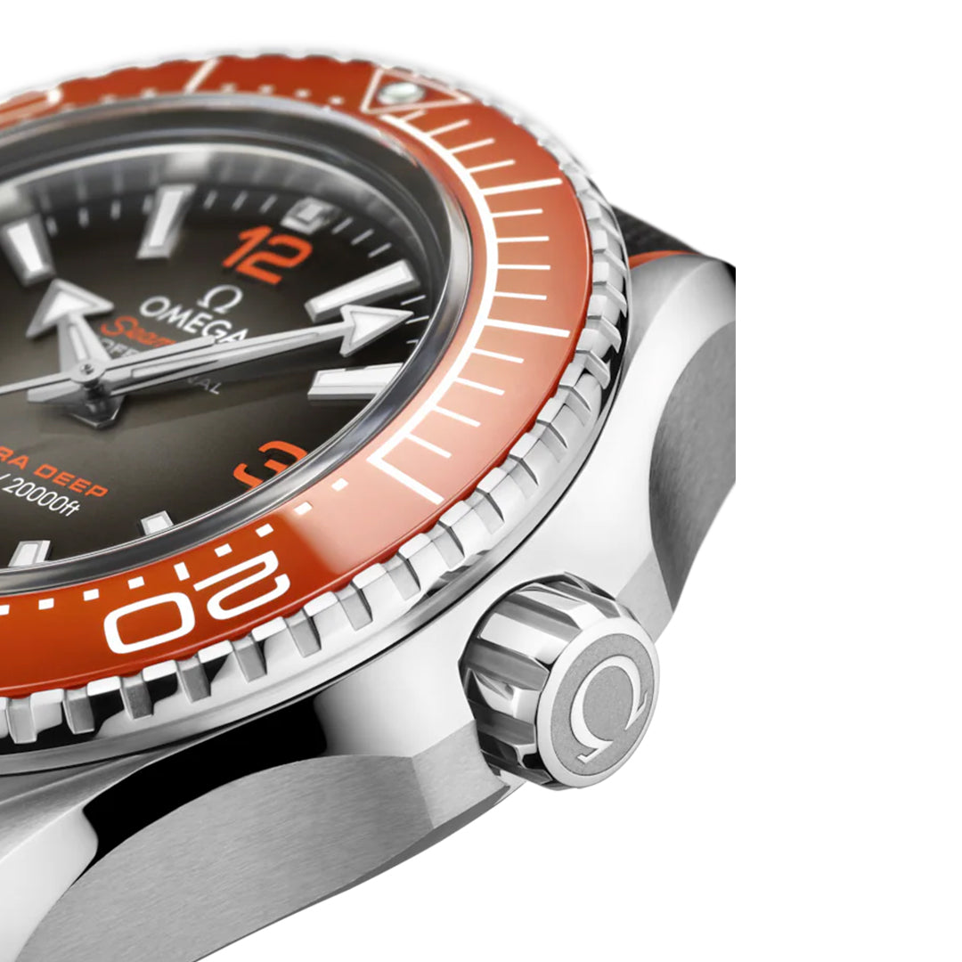 Close-up of the OMEGA Seamaster Planet Ocean 6000M Ultra Deep Co-Axial Master Chronometer 45.5mm Watch, featuring a striking O-MEGASTEEL case and vibrant orange bezel with minute markings. The detailed crown and Super-LumiNova enhance its bold numbers and prominently display the OMEGA logo.
