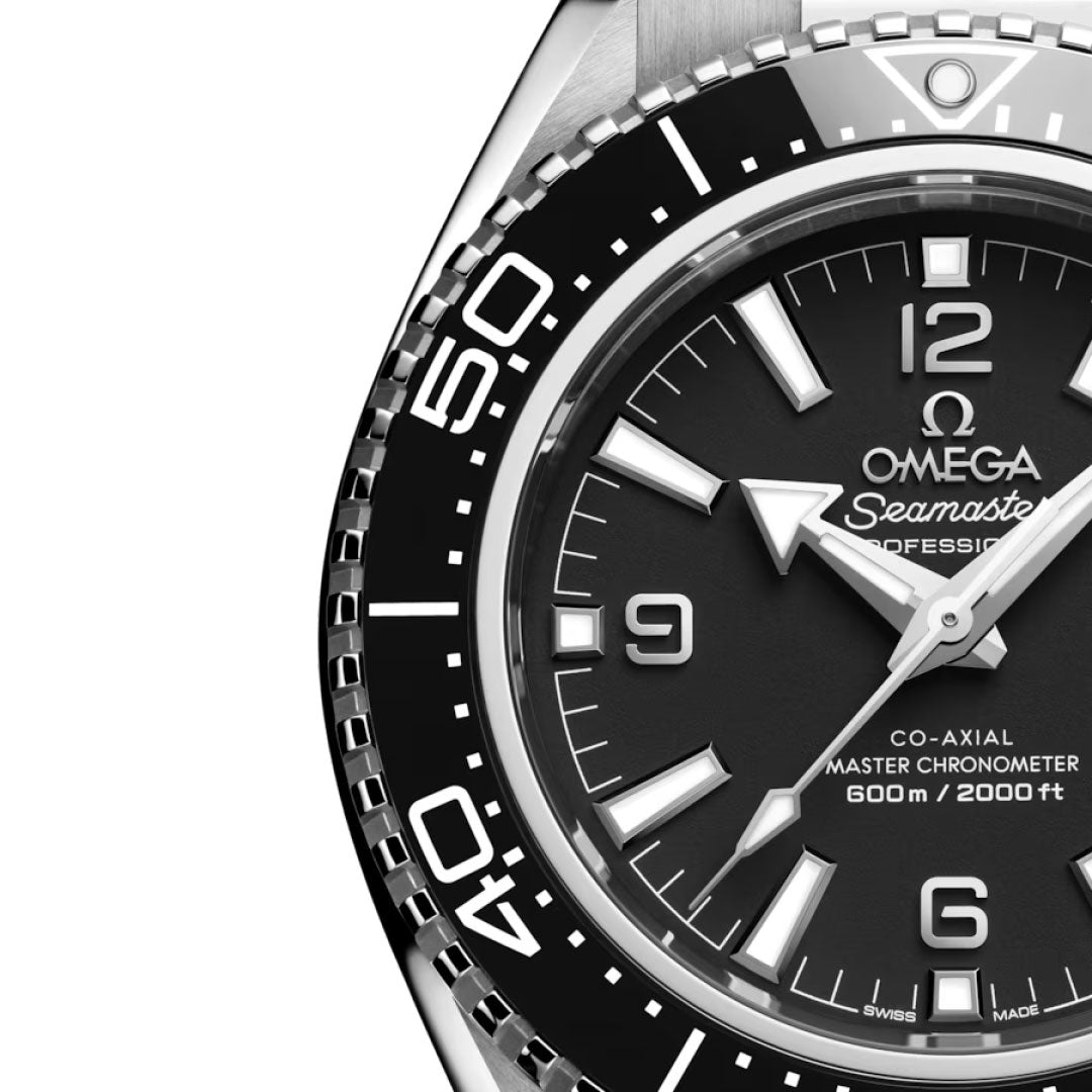 Close-up of the OMEGA Seamaster Planet Ocean 600M Co-Axial Master Chronometer 42mm Watch, featuring a black dial, white hour markers, silver hands, and a black bezel with white numerals. Water-resistant to 600m/2000ft.