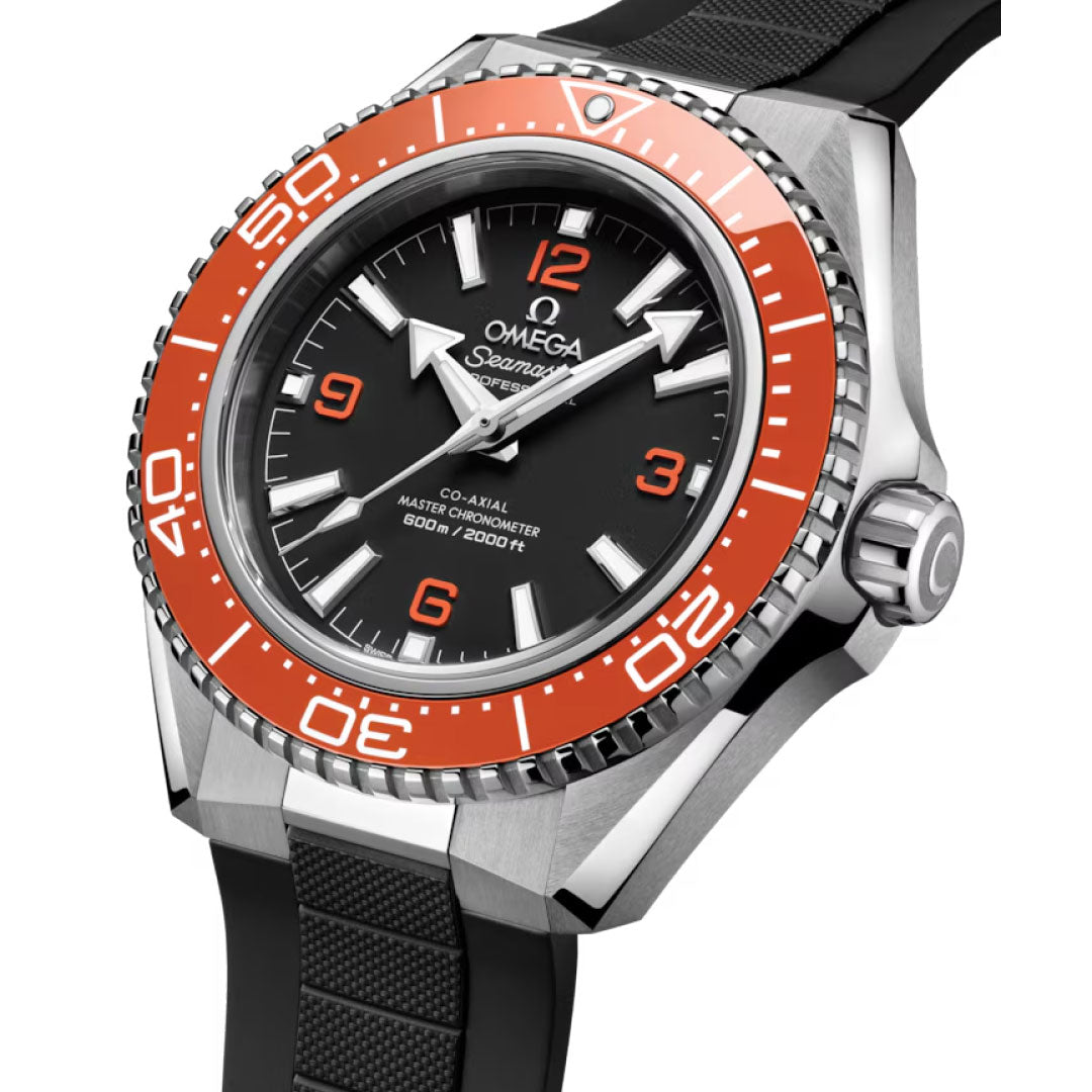 A close-up of the OMEGA Seamaster Planet Ocean 600M Co-Axial Master Chronometer 42mm Watch featuring a black dial, orange bezel, black rubber strap, white hour markers, three orange numerals, and "600m/2000ft" on the face.