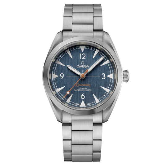 The OMEGA Seamaster Railmaster Co-Axial Master Chronometer 40mm Watch features a striking blue dial with Arabic numerals positioned at 12, 3, 6, and 9. This timepiece by OMEGA is equipped with the Co-Axial Master Chronometer Calibre 8806 and boasts luminescent hands alongside a sophisticated metal bracelet for an anti-magnetic finish.