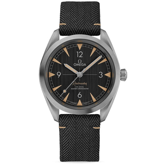 The OMEGA Seamaster Railmaster Co-Axial Master Chronometer 40mm Watch boasts a sophisticated black dial and silver case, highlighted by arrow-shaped hands with Super-LumiNova for enhanced visibility. The word "Railmaster" is elegantly displayed on the face, perfectly paired with a textured black strap.