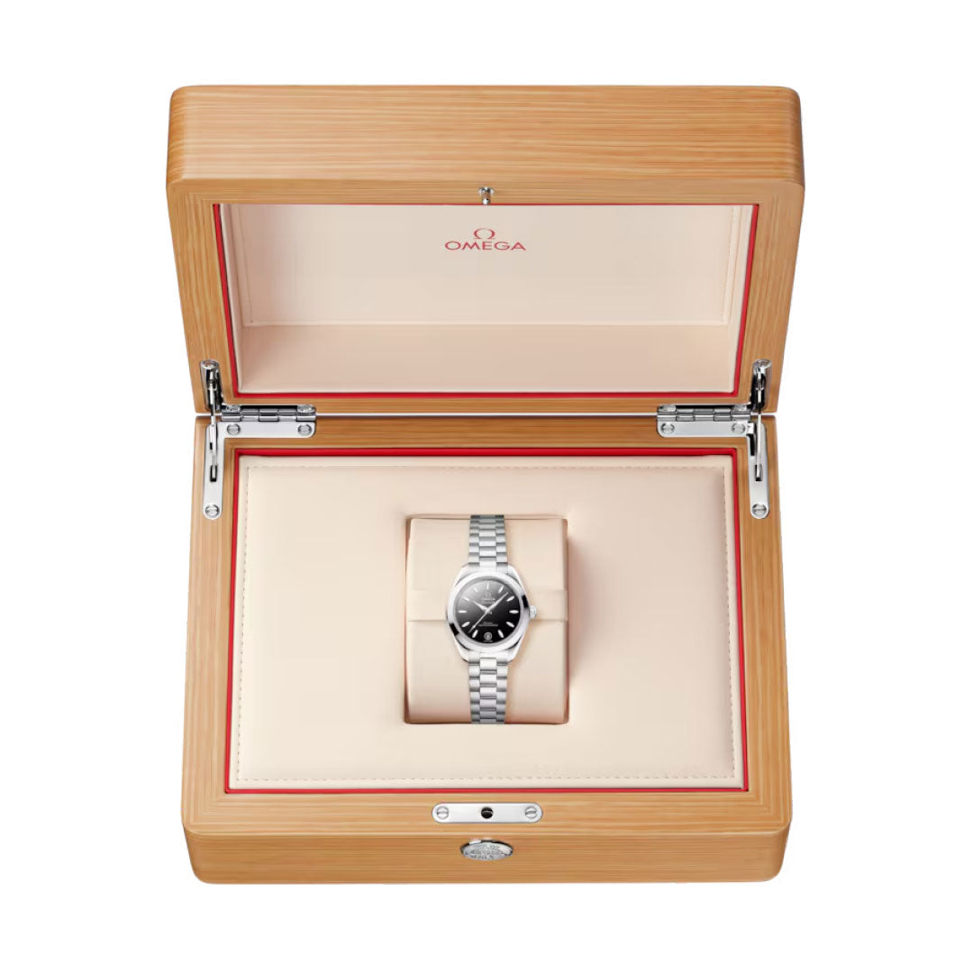An OMEGA Seamaster Aqua Terra 150M Co-Axial Master Chronometer 30mm watch by OMEGA is displayed in an open wooden box with a cream and red interior, featuring the OMEGA logo on the inside lid.