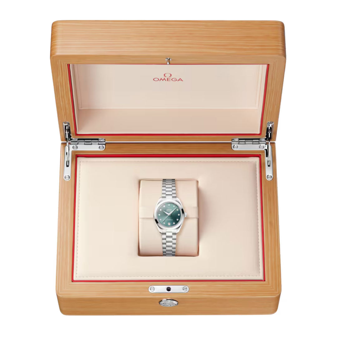 The OMEGA Seamaster Aqua Terra 150M Co-Axial Master Chronometer 30mm Watch features a silver case, green dial, and comes in a light wood OMEGA box with cream interior and red accents. Powered by the Co-Axial Master Chronometer movement.