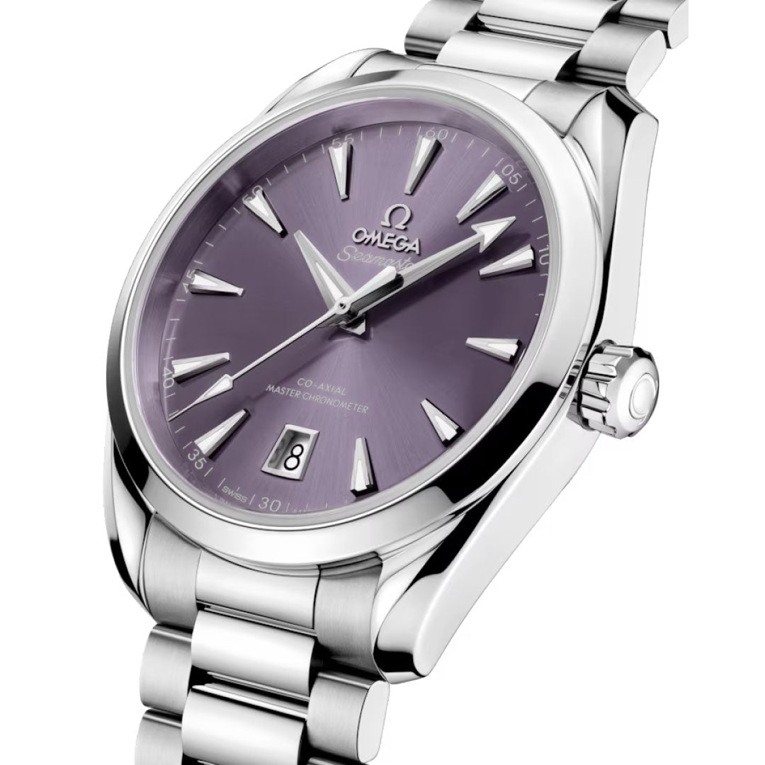 A close-up of the OMEGA Seamaster Aqua Terra Shades Co-Axial Master Chronometer 38mm Watch showcases its metallic purple dial, silver markers and hands, date at 6 o’clock, and polished stainless steel case and bracelet.