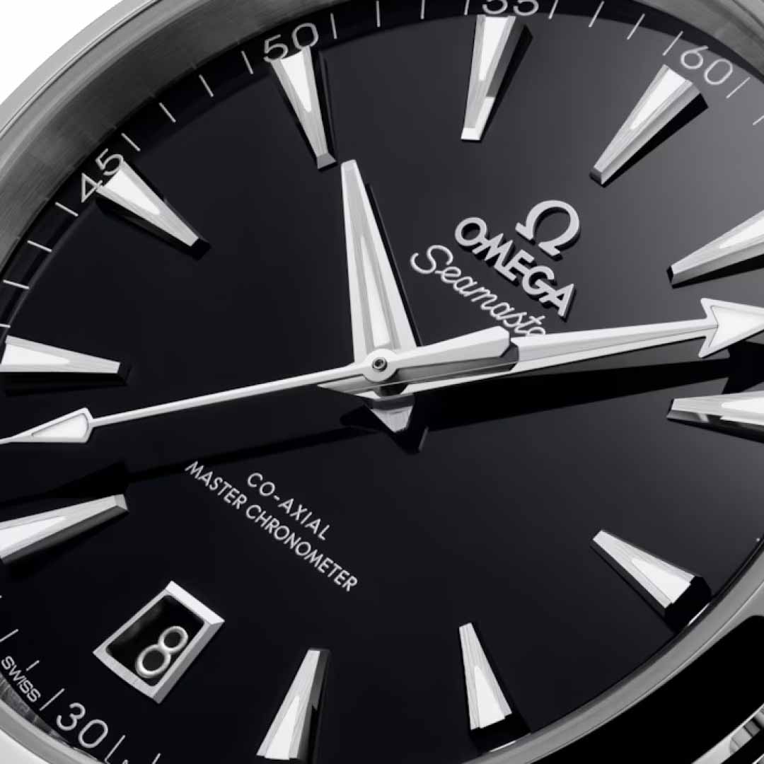 Close-up of an OMEGA Seamaster Aqua Terra 150m Co-Axial Master Chronometer 41mm Watch featuring a glossy black dial. This watch showcases silver hour markers and hands, a date display at 6 o'clock, and the "Co-Axial Master Chronometer calibre 8900" inscription.