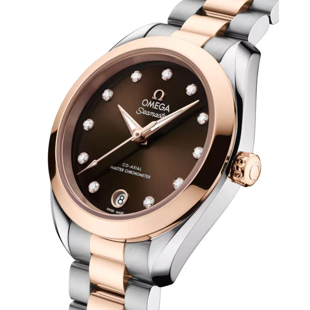 A close-up of the OMEGA Seamaster Aqua Terra 150M Co-Axial Master Chronometer 30mm watch featuring a brown dial, diamond hour markers, two-tone 18K Sedna Gold and steel case and bracelet, and a date window at 6 o’clock.