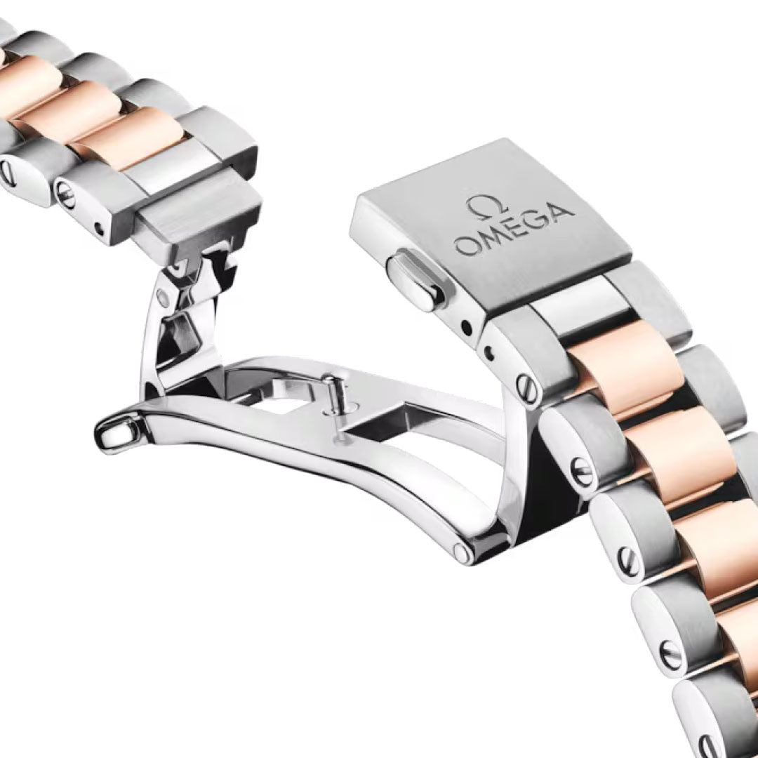 A close-up of the OMEGA Seamaster Aqua Terra 150M Co-Axial Master Chronometer 30mm watch clasp and bracelet, highlighting alternating silver and 18K Sedna Gold links, shown open against a white background.