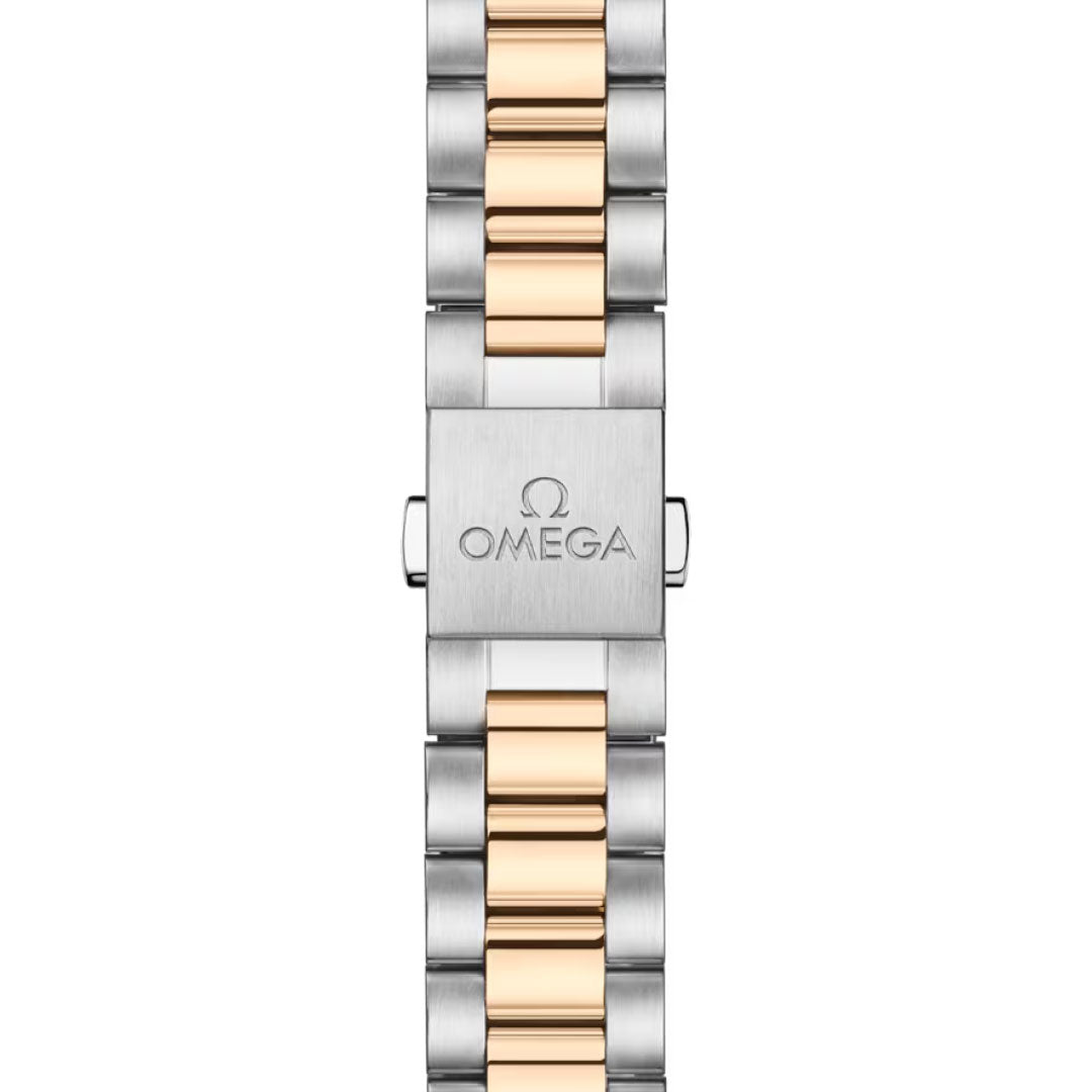 A close-up of the OMEGA Seamaster Aqua Terra Shades Co-Axial Master Chronometer 34mm Watch bracelet, showing alternating silver and Moonshine™ Gold links with the Omega logo engraved on the silver clasp.