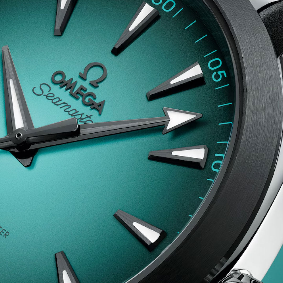 Close-up of the OMEGA Seamaster Aqua Terra 150M Co-Axial Master Chronometer 41mm Watch, showcasing a gradient teal dial, bold black hour markers, silver hands, and "Seamaster" text on the signature OMEGA face.