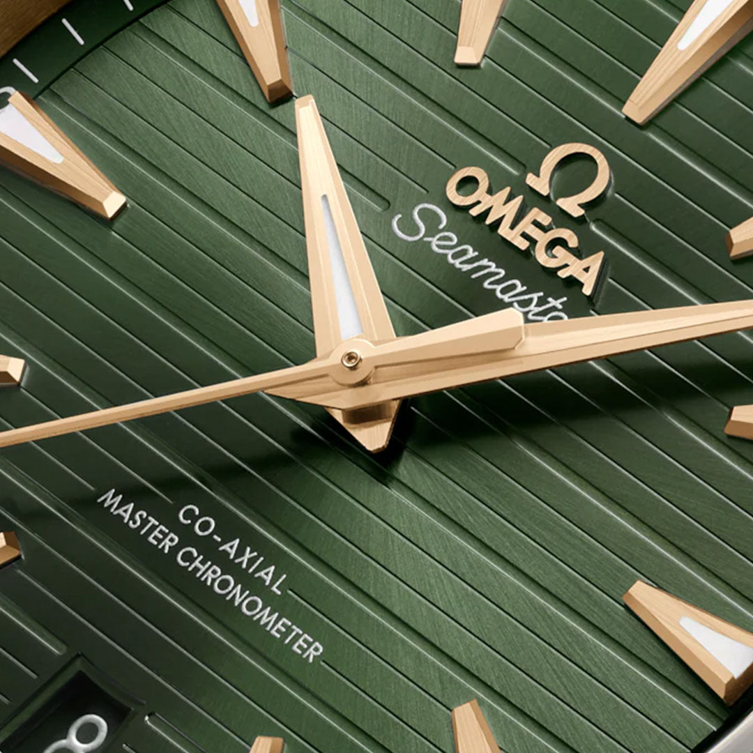 Close-up of the OMEGA Seamaster Aqua Terra 150M Co-Axial Master Chronometer 41mm, featuring a green textured dial with gold hour markers, hands, and luxurious 18K Moonshine™ Gold accents.