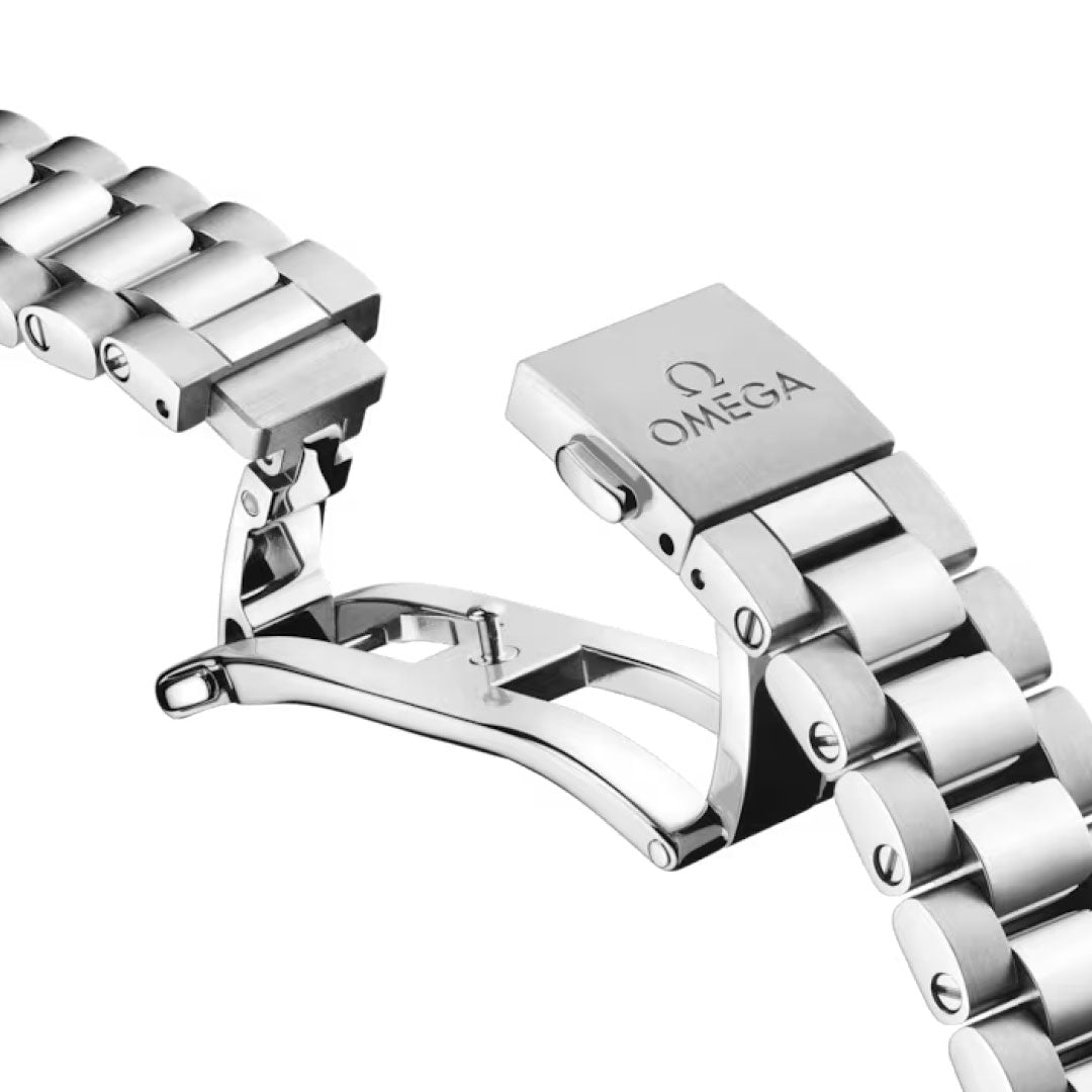 A close-up of the OMEGA Seamaster Railmaster Co-Axial Master Chronometer 38mm's stainless steel bracelet with a partially opened deployment clasp, highlighting the engraved OMEGA logo on the clasp cover.