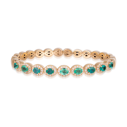 The Raffi&Co.® 18K Rose Gold Oval Emerald with Diamond Accent Bracelet showcases oval emerald gemstones, each surrounded by delicate white diamonds. The gemstones are evenly distributed along the bracelet, offering a luxurious and elegant design with diamond accents from Raffi&Co.