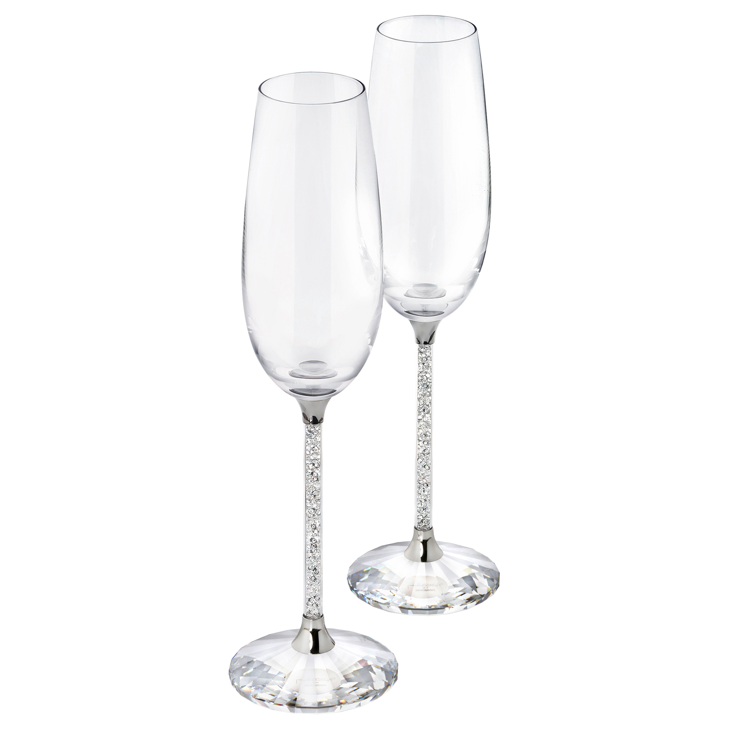 The Swarovski Crystalline Toasting Flutes, a set of two exquisite crystal flutes featuring elegant bases and long, slender stems, stand side by side against a plain background, poised to enhance any special occasion with their sophisticated charm.