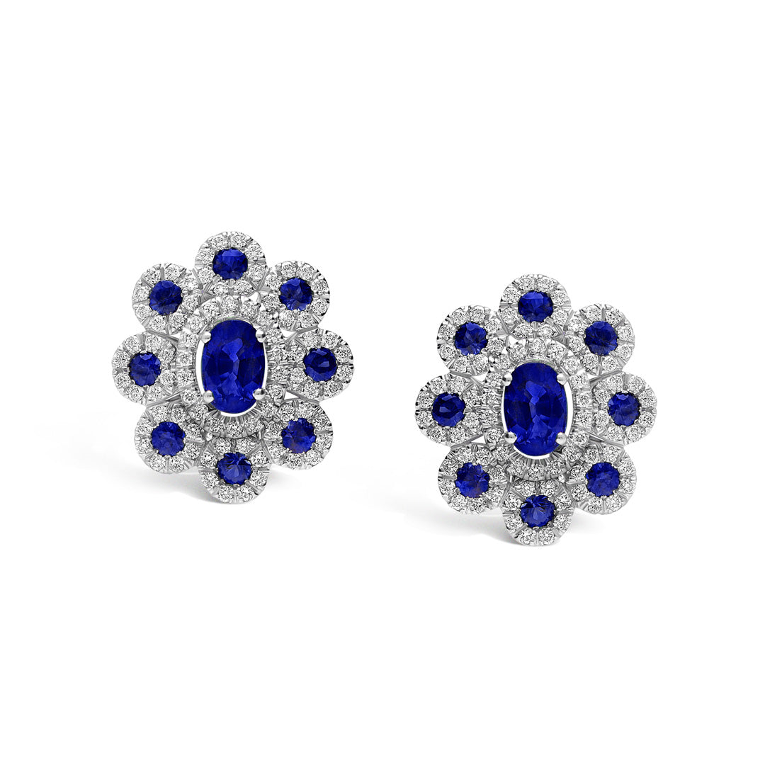 Experience vintage elegance with Leo Pizzo Augusta Collection 18K White Gold Diamond Sapphire Stud Earrings, featuring a large central blue gemstone surrounded by natural sapphires and sparkling gems.
