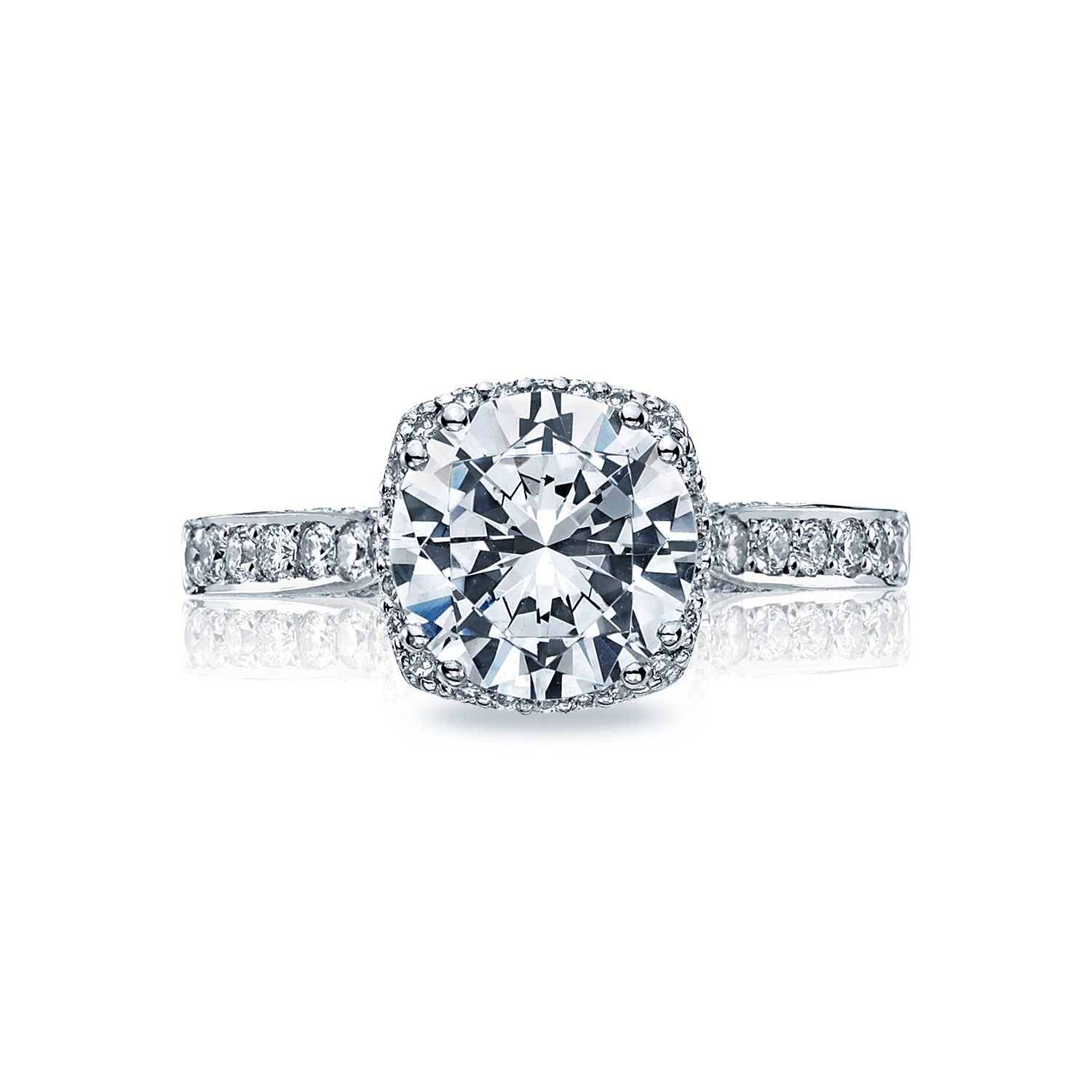 The Tacori Dantela 18K White Gold Round Brilliant Semi Mount Engagement Ring is an exquisite choice, featuring a central setting designed for a large round diamond. It showcases a beautiful diamond-adorned band and includes Tacori's signature hidden halo that adds an extra layer of sparkle, enhancing its allure among engagement rings.