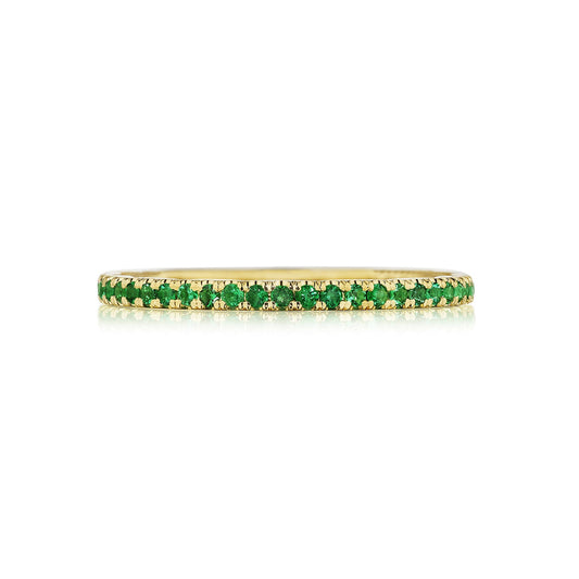 The Tacori Sculpted Crescent 18K Yellow Gold Ring is a thin and elegant piece adorned with a continuous row of vibrant green round brilliant emeralds, making it a unique choice for an engagement ring.