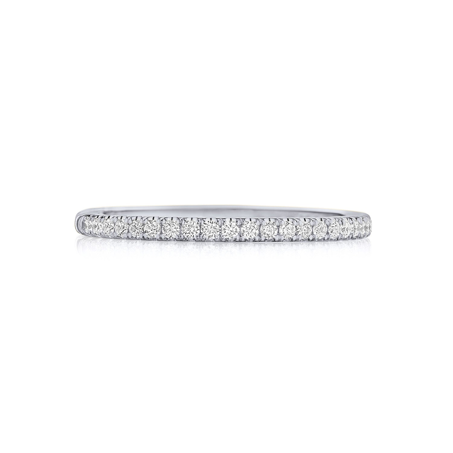 The Tacori Simply 18K White Gold Round Brilliant French Pavé Diamond Anniversary Ring is an elegant piece, featuring a sleek design crafted from shiny metal. It is beautifully adorned with pave-set diamonds that sparkle brilliantly across its surface, showcased against a plain white background.