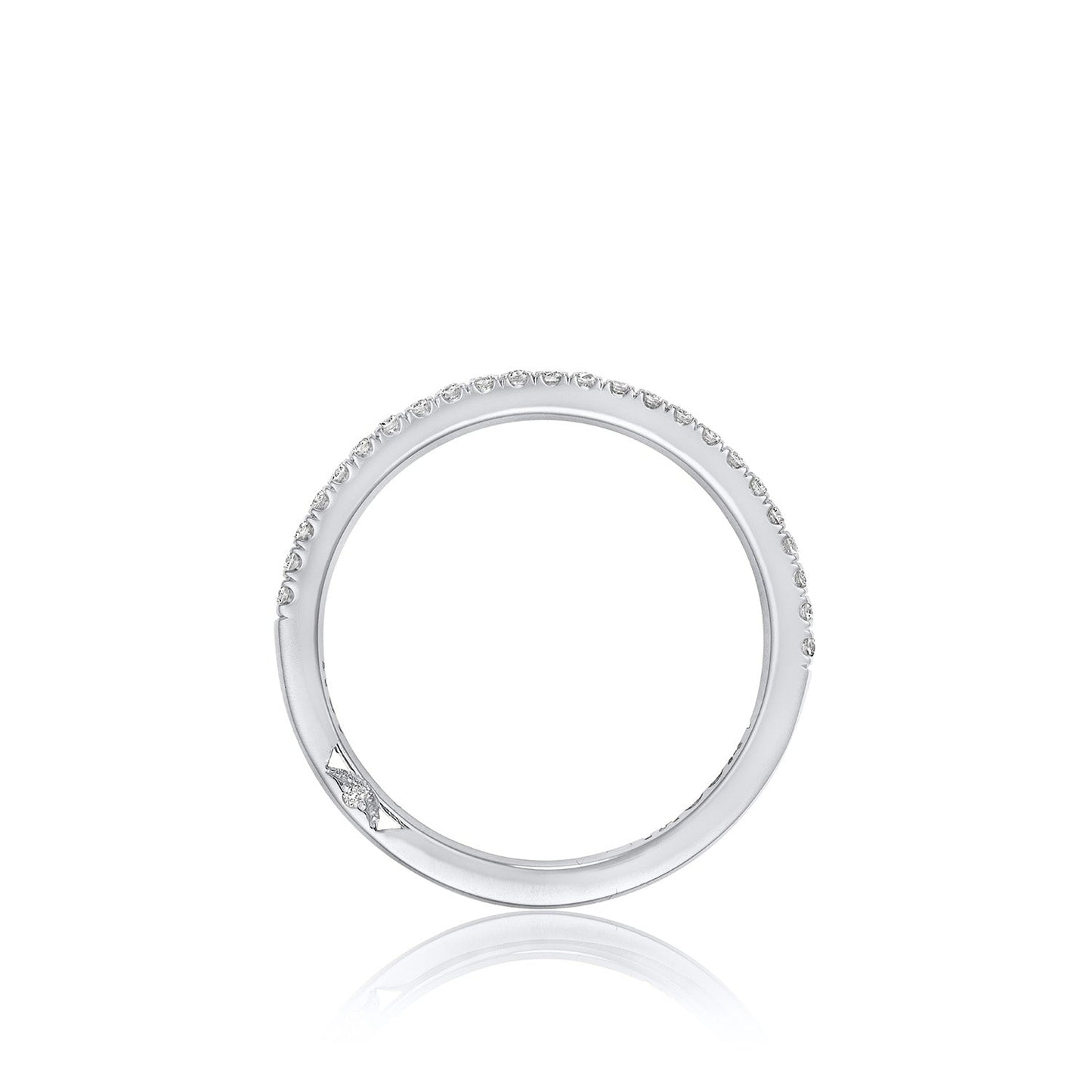 The Tacori Simply 18K White Gold Round Brilliant French Pavé Diamond Anniversary Ring features a stunning silver circular design with small diamonds gracing the top half, showcasing the exquisite craftsmanship characteristic of TACORI, all set against a white background.