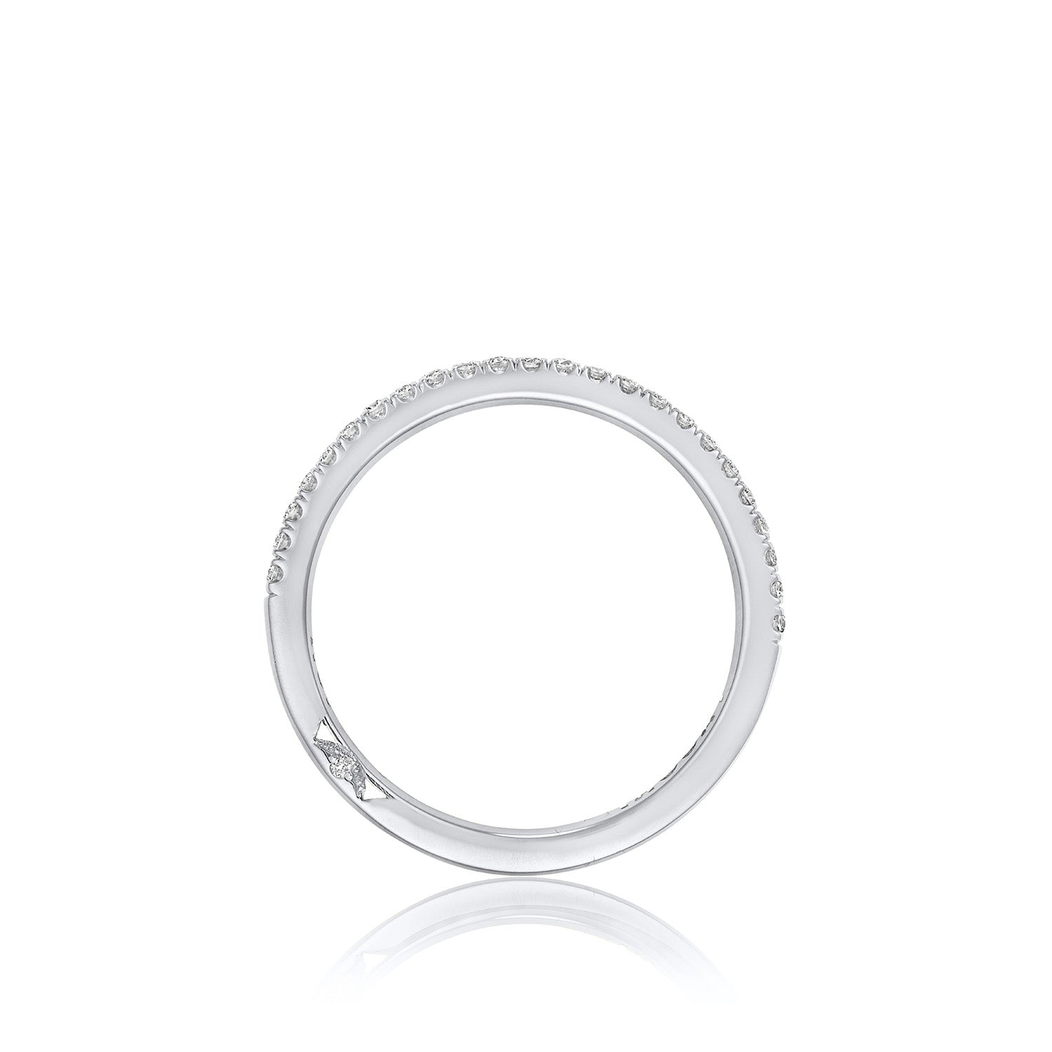 The Tacori Simply 18K White Gold Round Brilliant French Pavé Diamond Anniversary Ring features a stunning silver circular design with small diamonds gracing the top half, showcasing the exquisite craftsmanship characteristic of TACORI, all set against a white background.