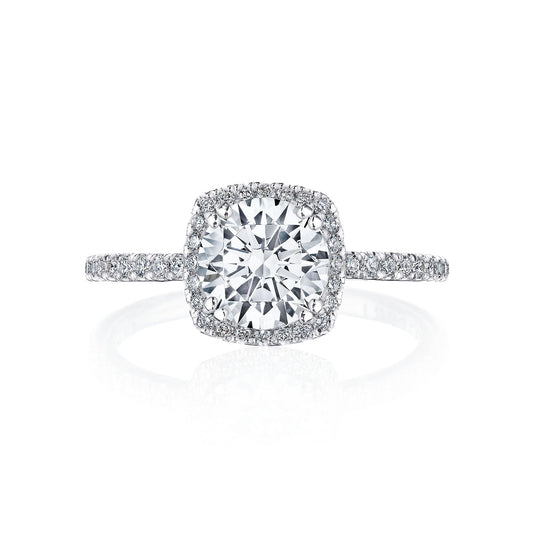 The Tacori Simply 18K White Gold Cushion Semi Mount with Diamond Band and Hidden Halo Engagement Ring is a stunning piece from the TACORI collection. It features a central stone setting surrounded by a dazzling diamond band and hidden halo, enhancing its elegance. Its luxurious design beautifully reflects light, making it an exquisite choice for any proposal.