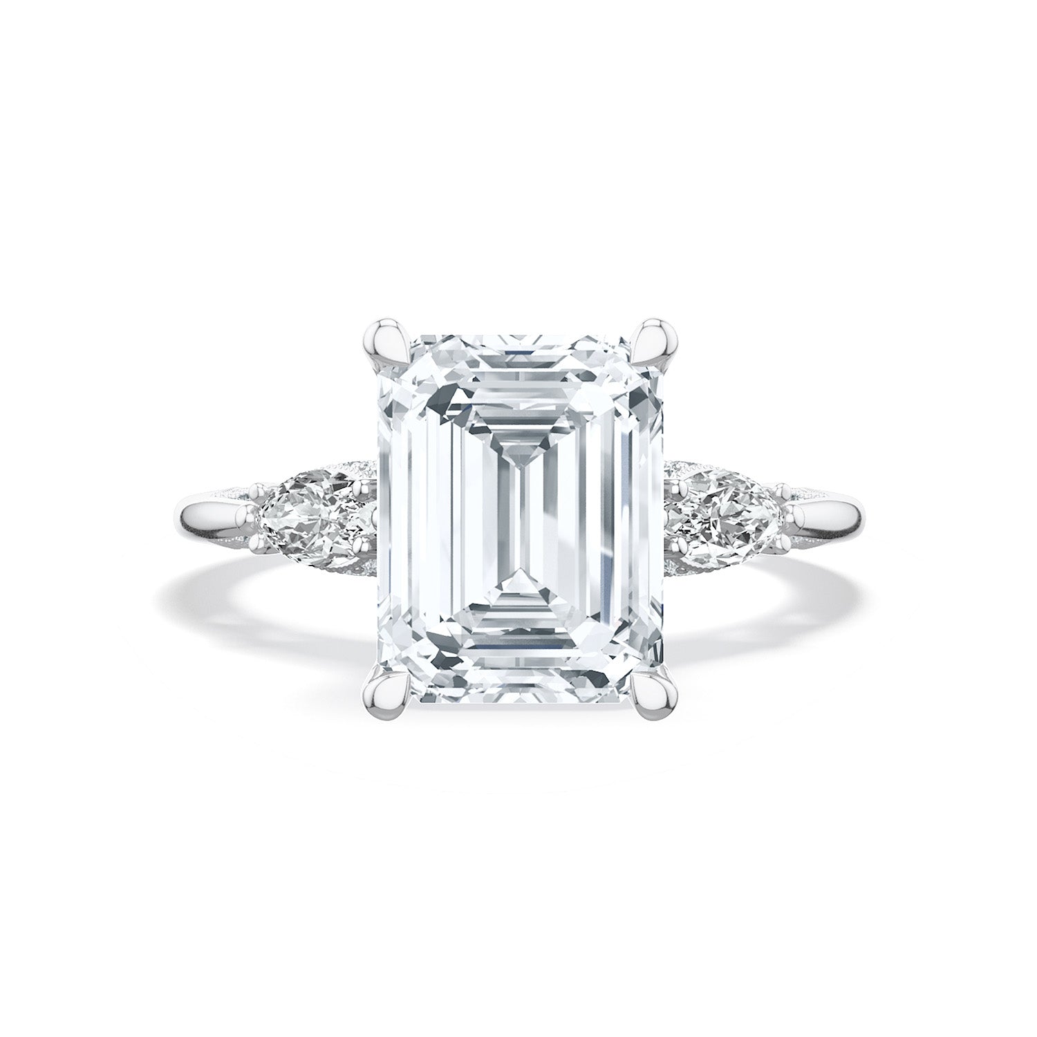 The Tacori Simply 18K White Gold Emerald Semi Mount Three Stone Engagement Ring with Diamond Accent Band and Side Stone features an emerald center stone, flanked by pear-shaped diamonds on either side, set against a plain white background.