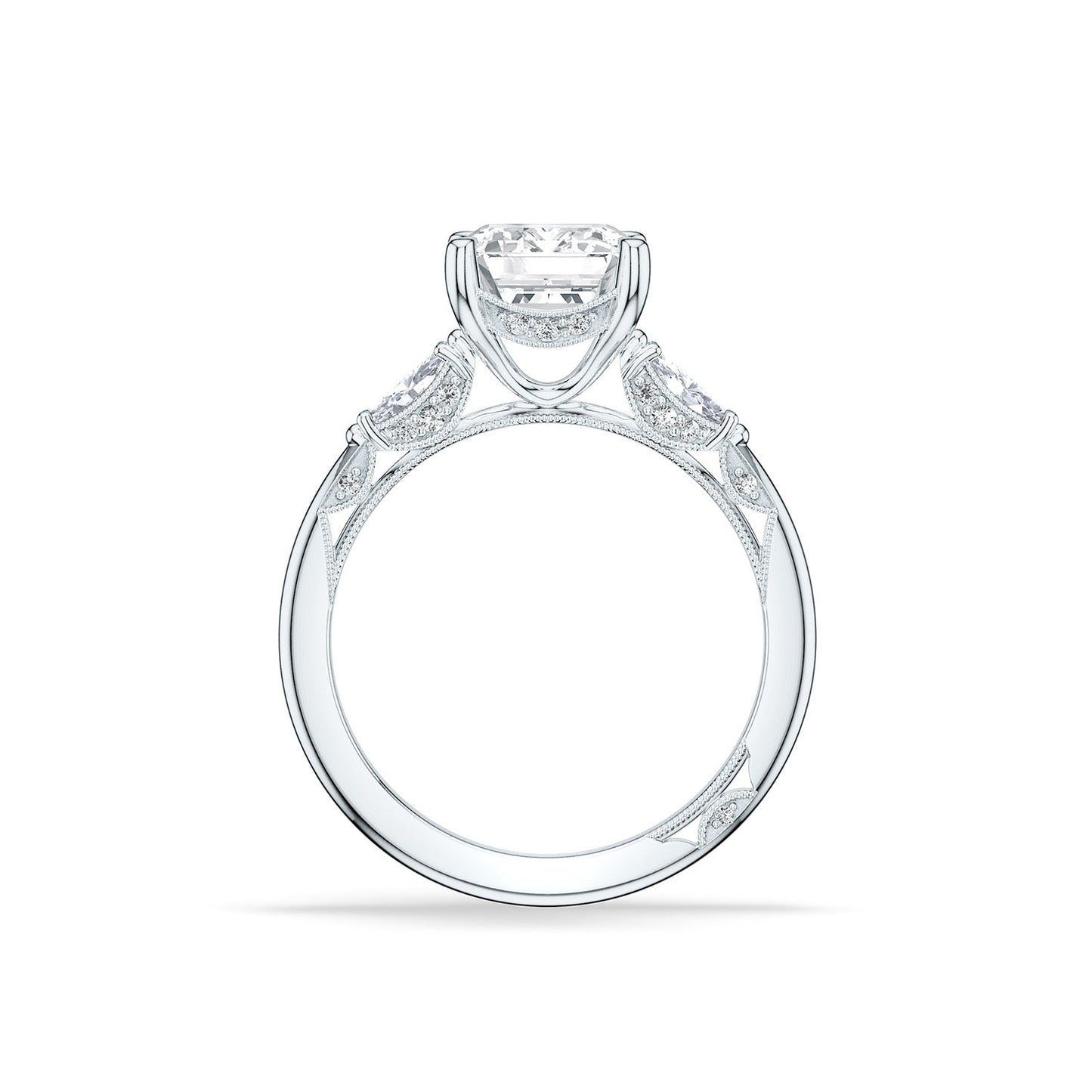 The Tacori Simply 18K White Gold Emerald Semi Mount Three Stone Engagement Ring highlights a diamond-adorned Cathedral foundation, featuring a prominent central diamond in a prong setting accompanied by two smaller diamonds. The band is distinguished by its intricate detailing and polished finish.