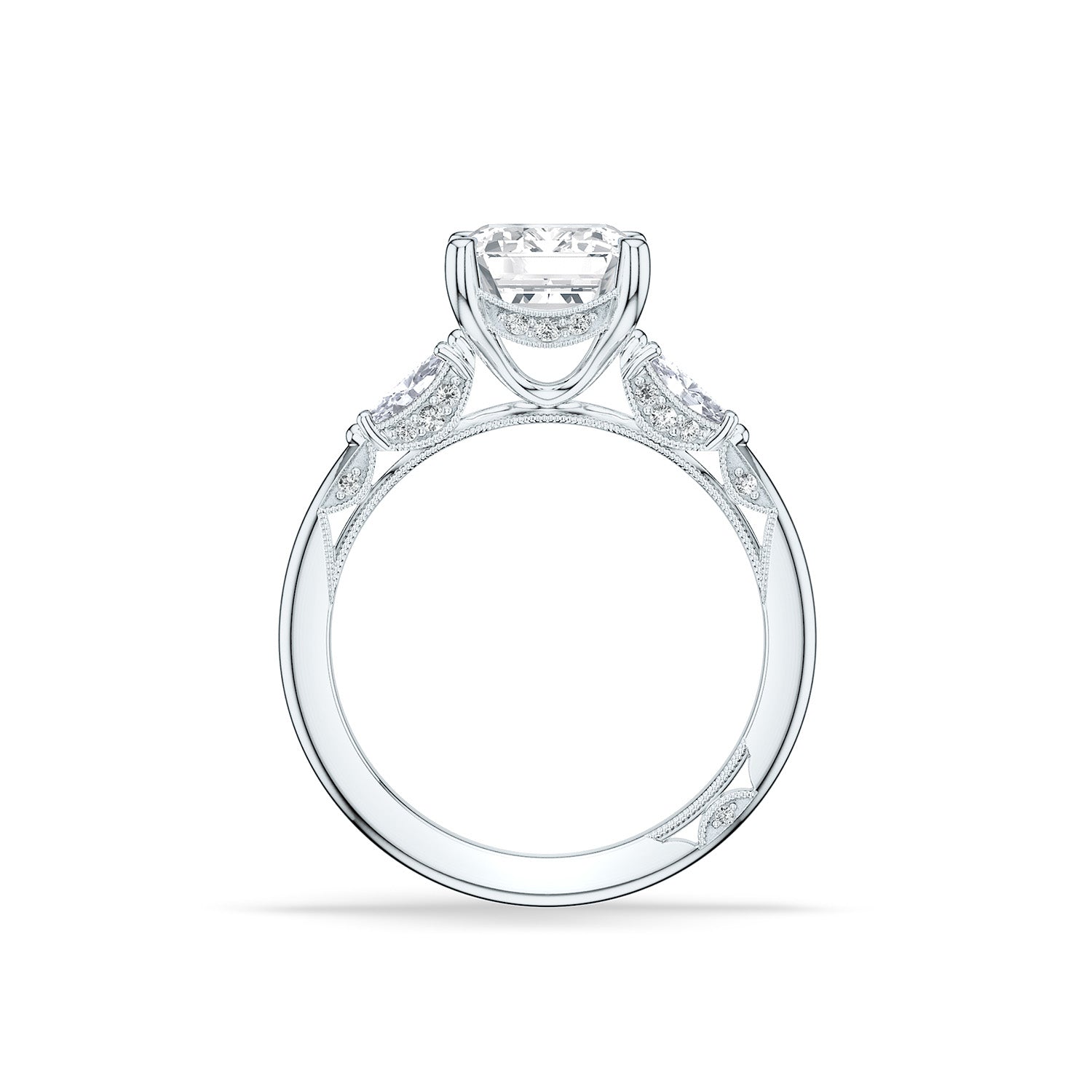 The Tacori Simply 18K White Gold Emerald Semi Mount Three Stone Engagement Ring highlights a diamond-adorned Cathedral foundation, featuring a prominent central diamond in a prong setting accompanied by two smaller diamonds. The band is distinguished by its intricate detailing and polished finish.