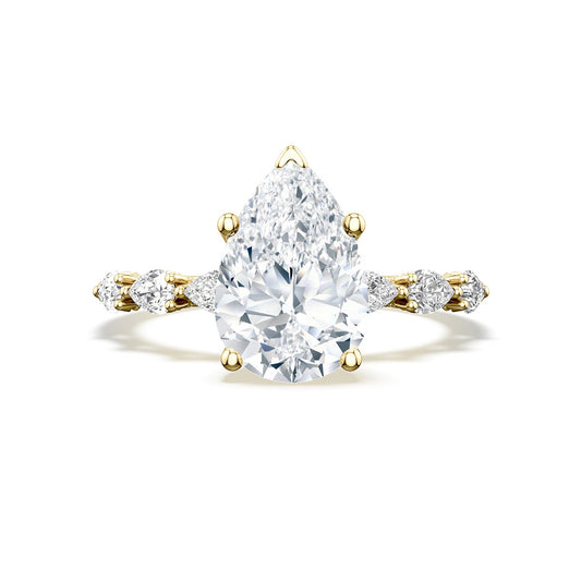 The Tacori Sculpted Crescent 18K White Gold Pear Solitaire Semi Mount Engagement Ring features an East-West oriented pear-shaped diamond at its center. The sophisticated design is enhanced by smaller round diamonds set along the band, showcasing the meticulous craftsmanship of Tacori gemologists.