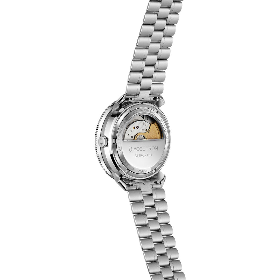 The Accutron Astronaut LTi Automatic 41mm Watch is shown from the back, revealing its automatic movement through a transparent case back. It features a metal link bracelet.
