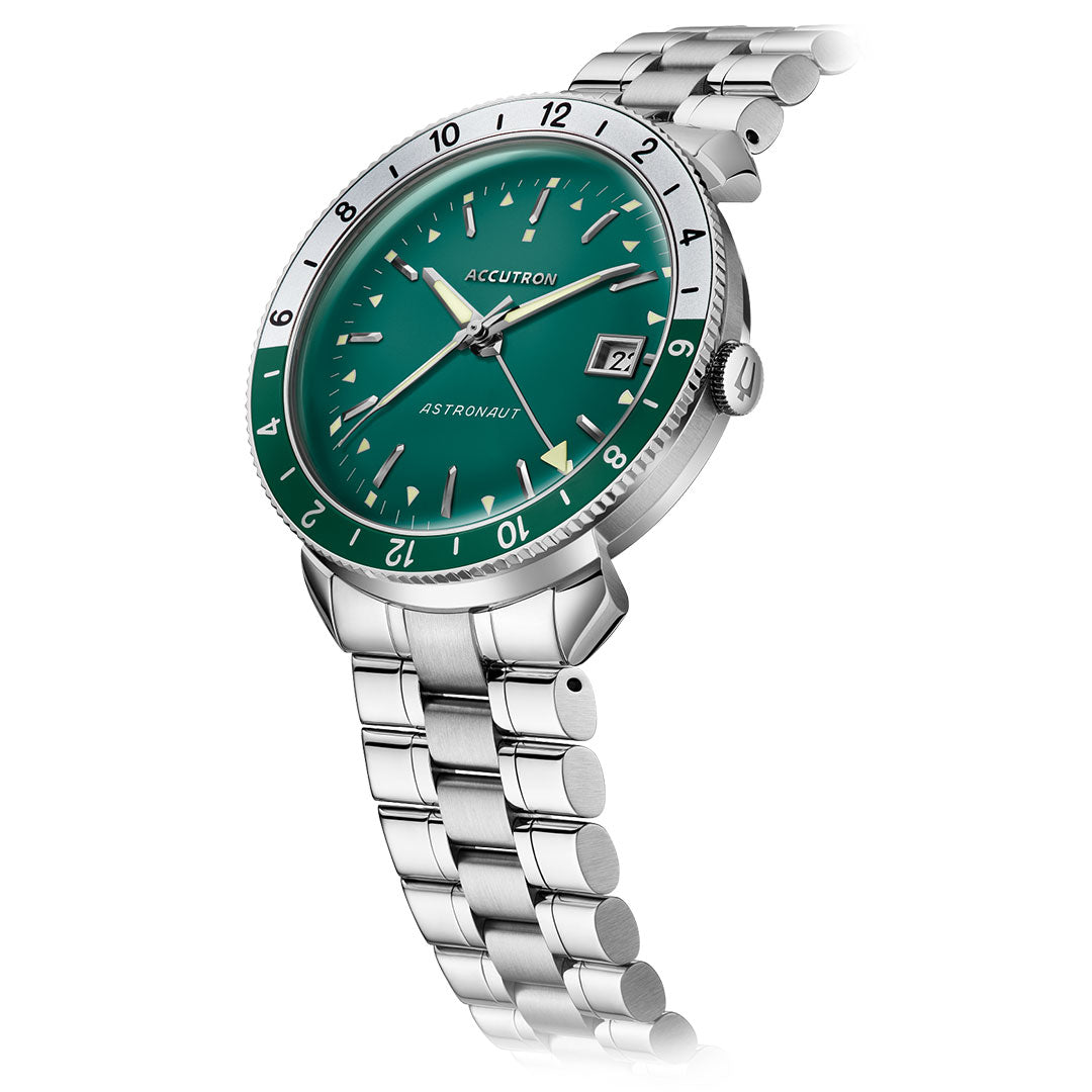 The Accutron Astronaut Automatic 41mm Watch features a green dial, silver hour markers, date window at 3 o’clock, and a matching silver metal bracelet, elegantly angled against a white background.