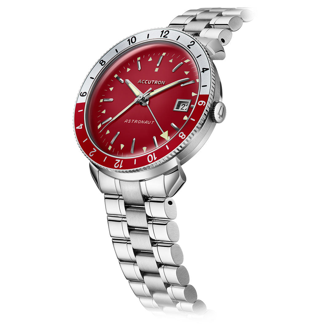 The Accutron Astronaut Automatic 41mm Watch by Accutron features a silver case, red dial, red-and-silver 24-hour bezel, silver hour markers, date at 3 o'clock, and a stainless steel link bracelet. It is shown at a diagonal angle for a dynamic look.