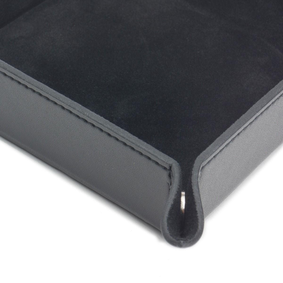 Close-up of the WOLF 1834 Heritage Coin Tray by WOLF—a black faux leather tray with raised edges, corner notch for easy lifting, and an ultra suede-lined interior that combines practicality with elegant style.
