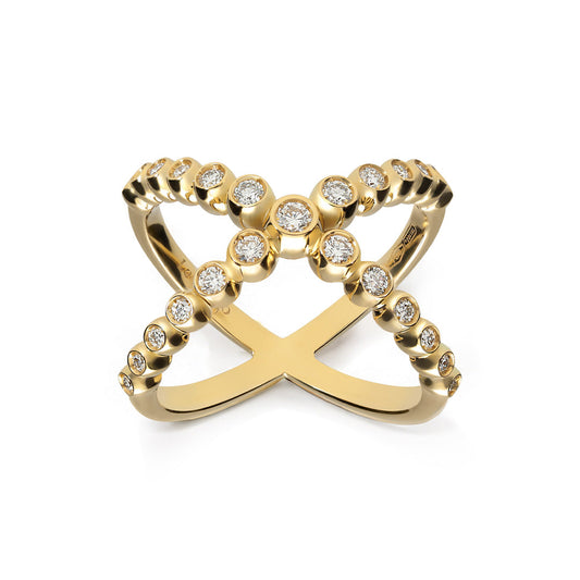 The Leo Pizzo Bubble Collection ring features an X-shaped design crafted in 18K yellow gold with two intersecting bands adorned with natural diamonds, each set in circular bezels, offering a stylish and elegant appearance.