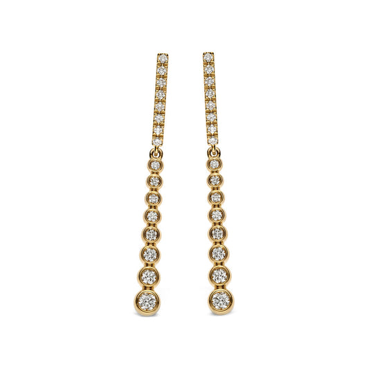 Introducing the Leo Pizzo Bubble Collection 18K Yellow Gold Diamond Drop Earrings: beautifully crafted in 18kt yellow gold, these earrings feature a linear design with natural diamonds that increase in size toward the bottom, creating a captivating shimmer.