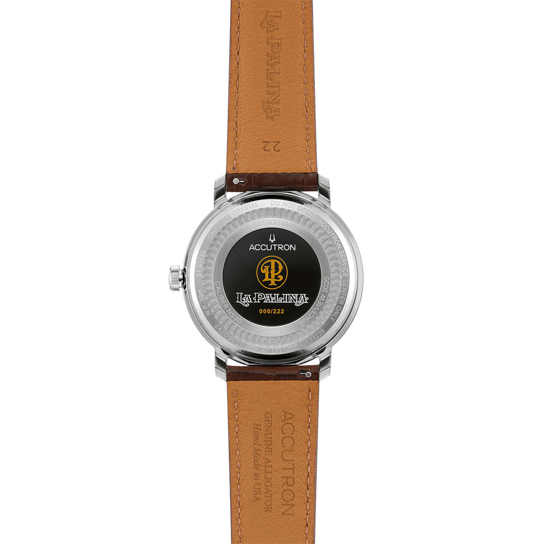 The back of the Accutron Spaceview 2020 Electrostatic 43.5mm Watch features a brown leather strap, Accutron and La Palina logos, a serial number on its stainless steel case, and design inspired by La Palina humidor’s handmade Nicaraguan cedar.