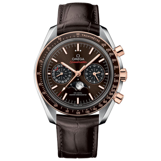The OMEGA Speedmaster Moonphase Co-Axial Master Chronometer Moonphase Chronograph 44.25mm Watch is a luxury timepiece featuring a brown leather strap, a dial with multiple sub-dials and a moon phase, and stopwatch functionality. Its bezel is adorned with a tachymeter scale, complemented by elegantly accented rose gold hands and markers.