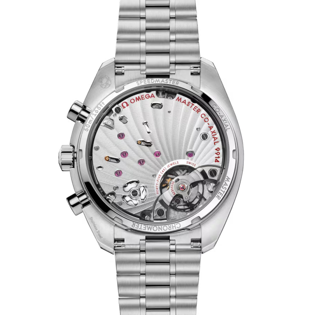 A close-up of the OMEGA Speedmaster Moonphase Co-Axial Master Chronometer Chronograph 43mm watch shows its intricate automatic movement through a transparent caseback, with "MASTER CO-AXIAL 9904" and other engravings around the edge.