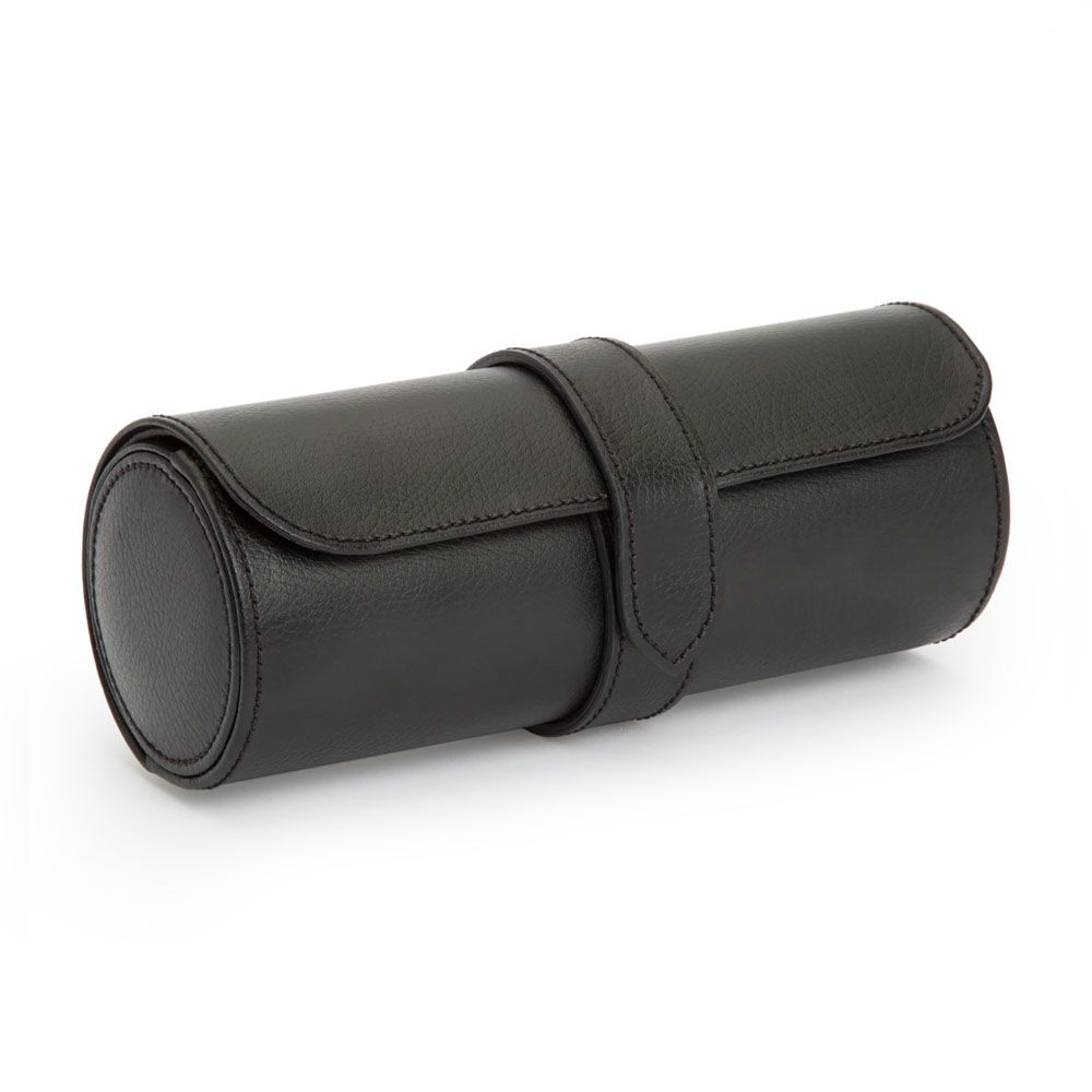 The WOLF Blake Watch Roll in Black/Grey by WOLF 1834 is a handcrafted leather cylindrical case with a flap and strap closure, ideal for storing watches or glasses, shown here against a white background.