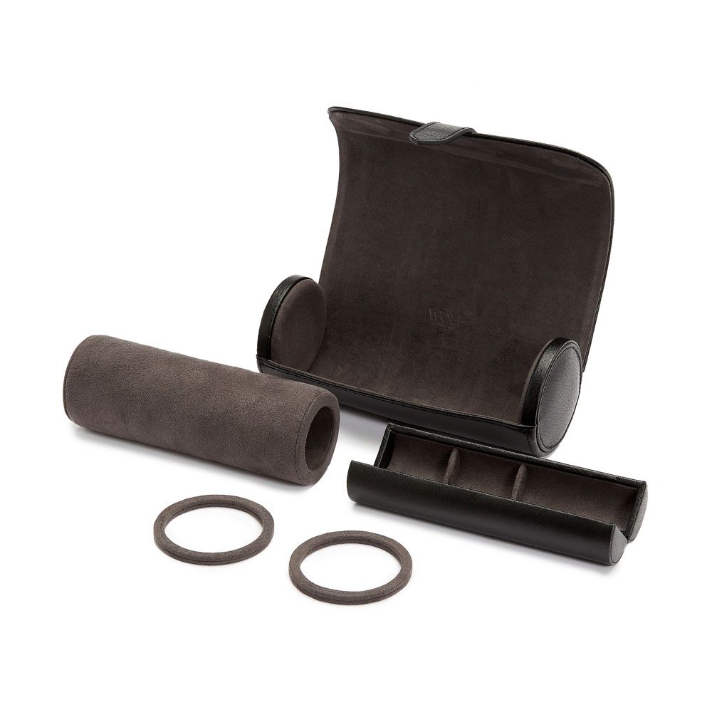 A WOLF 1834 Blake Watch Roll With Capsule in Black/Grey is open, displaying a cylindrical watch holder, two ring slots, and space for three watches. This handcrafted travel roll from WOLF seamlessly combines elegant design with secure functionality.
